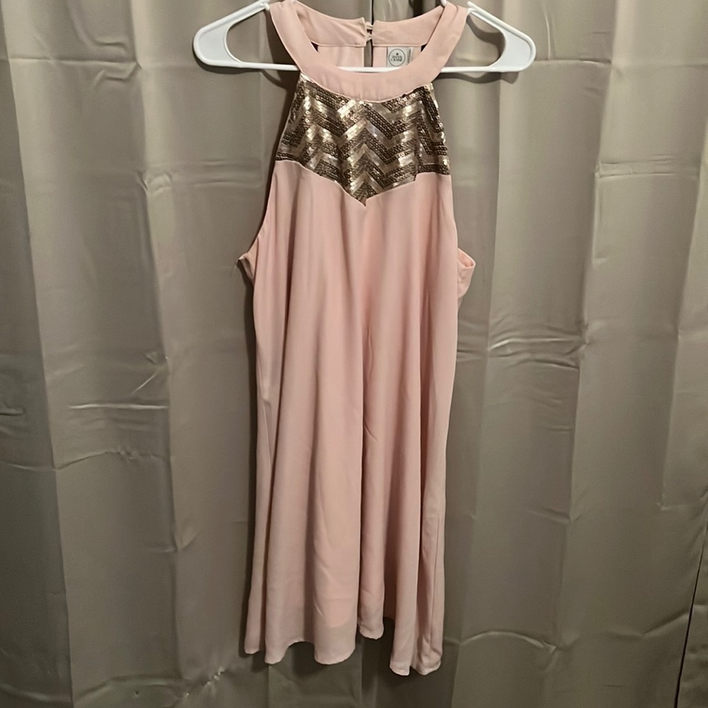 Sleeveless high neckline flowy knee length dress